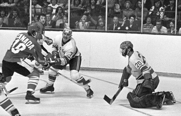 Team Canada's Paul Henderson (L) shoots on Team USSR's Vladislav Tretiak while Gennady Tsygankov defends during the 1972 Summit Series in Toronto on Sept. 4, 1972. (The Canadian Press/Peter Bregg)