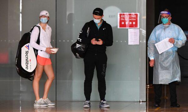 Tennis players leave their hotel for a practice session ahead of the Australian Open in Melbourne on Jan. 20, 2021. (William West via Getty Images)