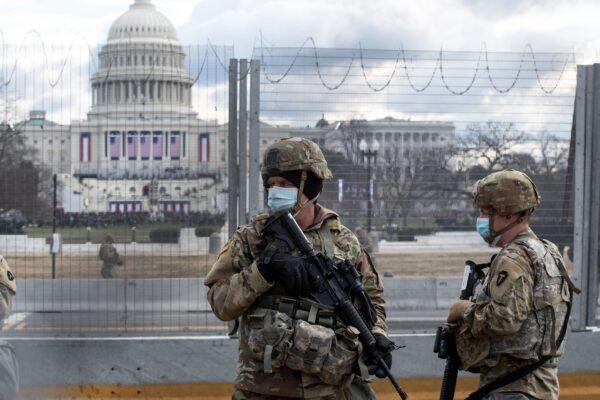 U.S. National Guard troops patrol the vicinity of the U.S. Capitol hours before the inauguration of President-elect Joe Biden in Washington on Jan. 20, 2021. (Roberto Schmidt/AFP via Getty Images)