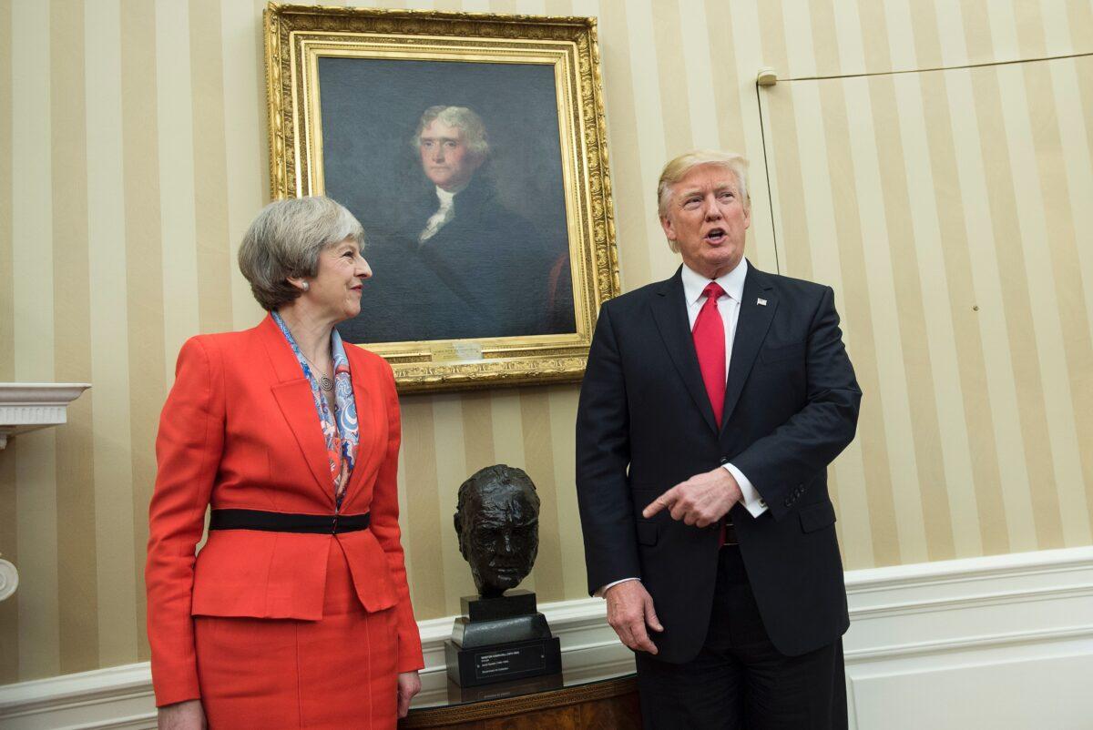 Former British Prime Minister Theresa May (L) and then President Donald Trump meet beside a bust of former British Prime Minister Winston Churchill in the Oval Office, in Washington, on Jan. 27, 2017. (Brendan Smialowski/AFP/Getty Images)