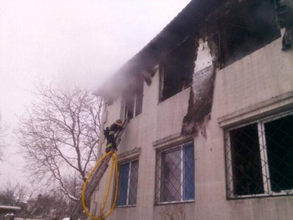 A rescuer works at the scene of the accident following a fire in nursing home in Kharkiv, Ukraine, on Jan. 21, 2021. (State Emergency Service of Ukraine/Handout via Reuters)