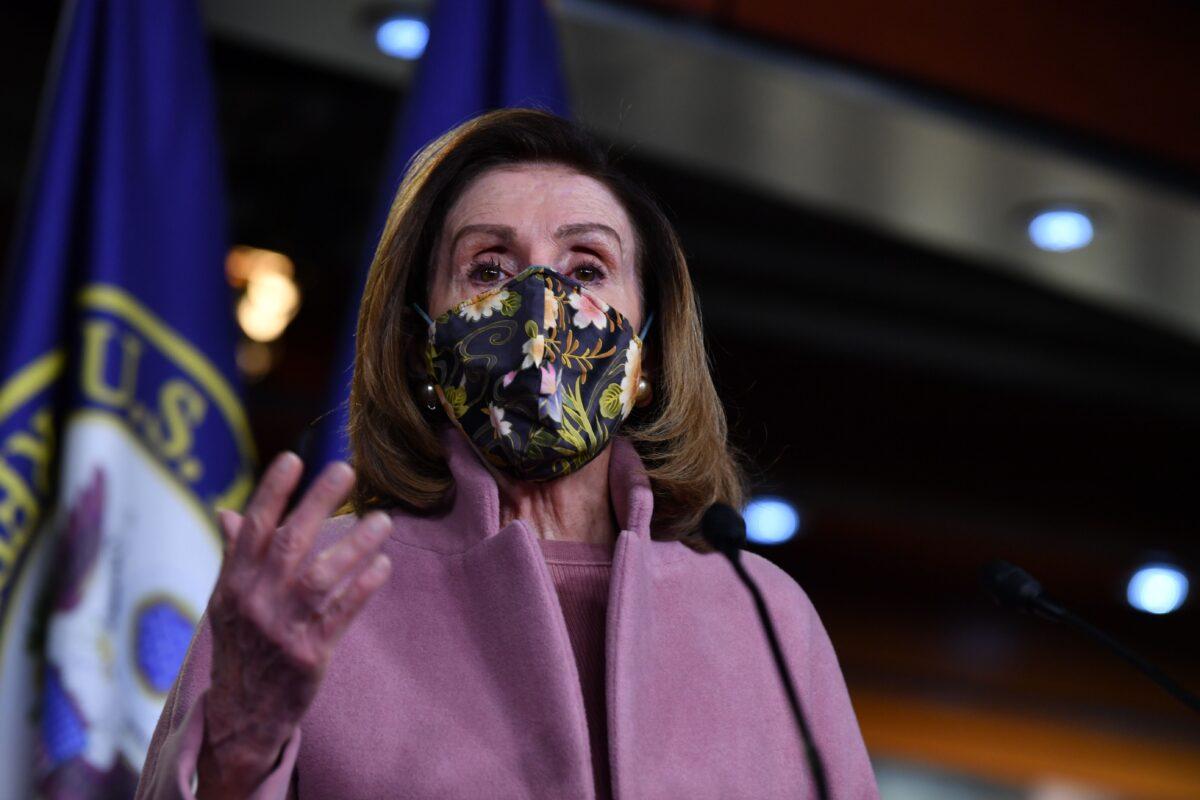 House Speaker Nancy Pelosi (D-Calif.) gestures during a press conference in Washington on Jan. 21, 2021. (Nicholas Kamm/AFP via Getty Images)