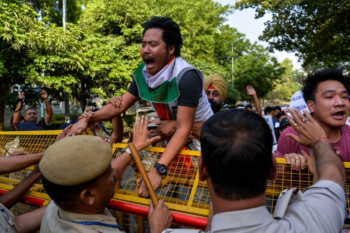 Demonstrators shout slogans as they protest against China's claim of six districts of Arunachal Pradesh state in New Delhi on April 25, 2017. (Chandan Khanna/AFP via Getty Images)