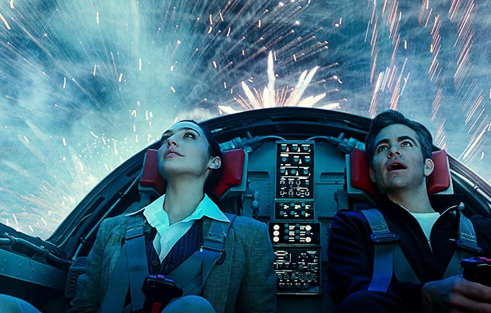 Wonder Woman (Gal Gadot) and her boyfriend, pilot Steve Trevor (Chris Pine), go for a ride in a stolen jet, in "Wonder Woman 1984." (Warner Bros.)