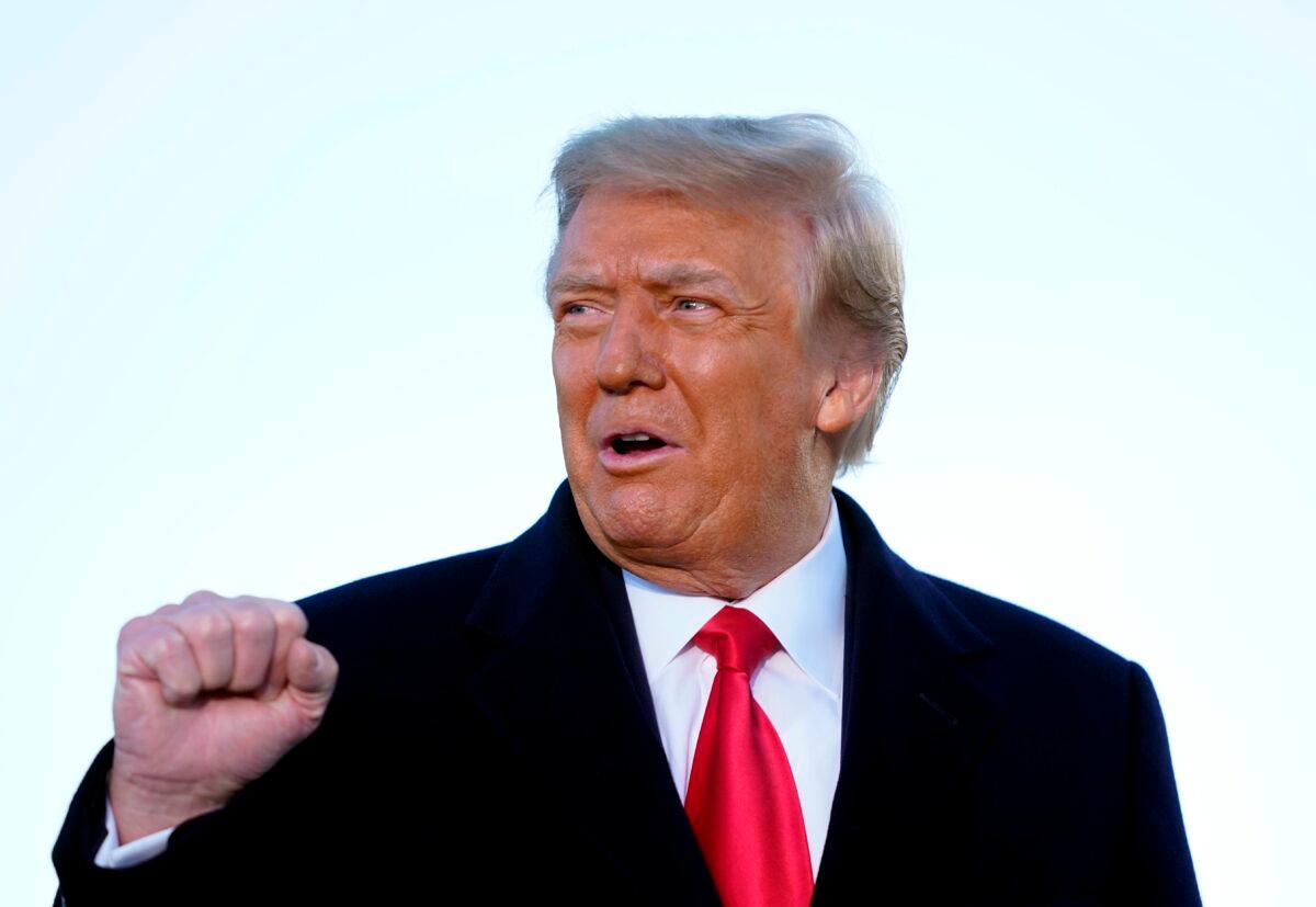 Then-President Donald Trump speaks before boarding Air Force One at Joint Base Andrews in Maryland on Jan. 20, 2021. (Alex Edelman/AFP via Getty Images)