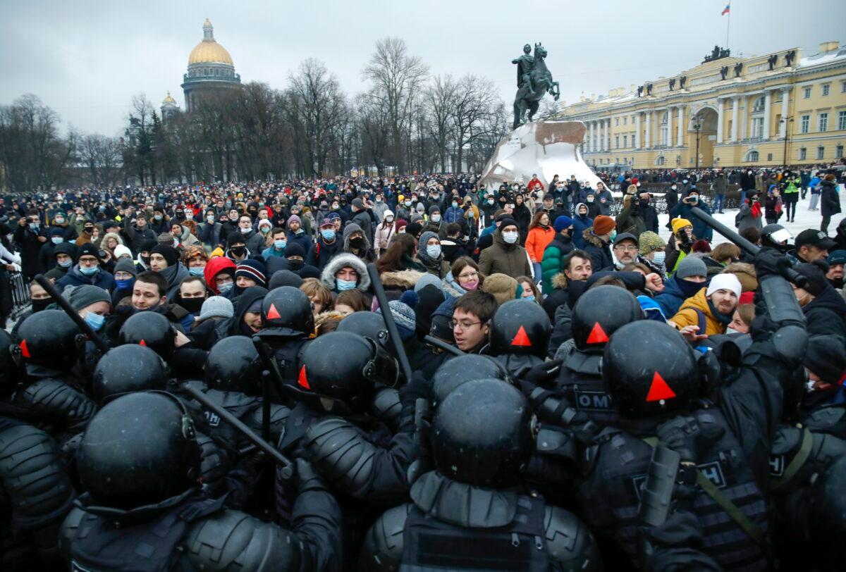 People clash with police during a protest against the jailing of opposition leader Alexei Navalny in St. Petersburg, Russia, on Jan. 23, 2021. (Dmitri Lovetsky/AP Photo)