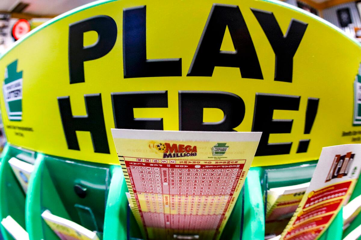 A Mega Millions playslip for those players preferring to choose the numbers they want to play is among the stacks of other lottery game playslips on display at a store in Cranberry Township, Pa., on Jan. 22, 2021. (Keith Srakocic/AP Photo)