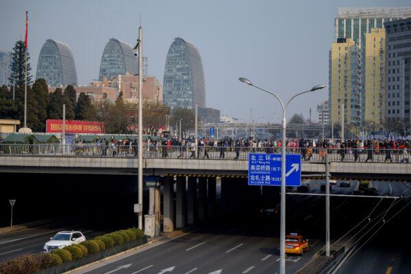 People line up to be tested for the COVID-19 in Beijing, on Jan. 23, 2021. (NOEL CELIS/AFP via Getty Images)