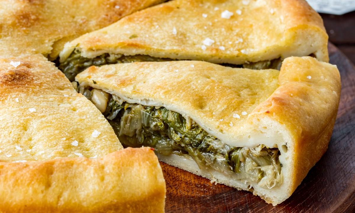 Bitter escarole, tamed by a medley of Mediterranean flavors, is the protagonist of this savory Neapolitan pie. (Giulia Scarpaleggia)