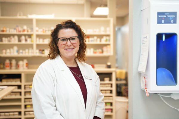 Pharmacist Ashley Brehme stands in the pharmacy she owns in Manchester, Iowa, on Jan. 16, 2021. (Cara Ding/The Epoch Times)