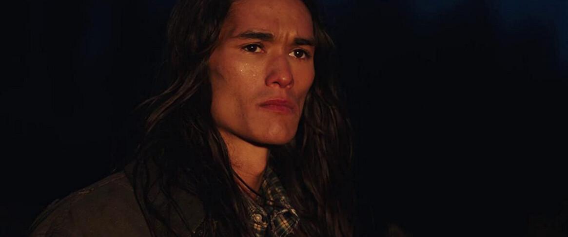 Booboo Stewart plays a solitary hunter/trapper in “Let Him Go.” (Focus Features)