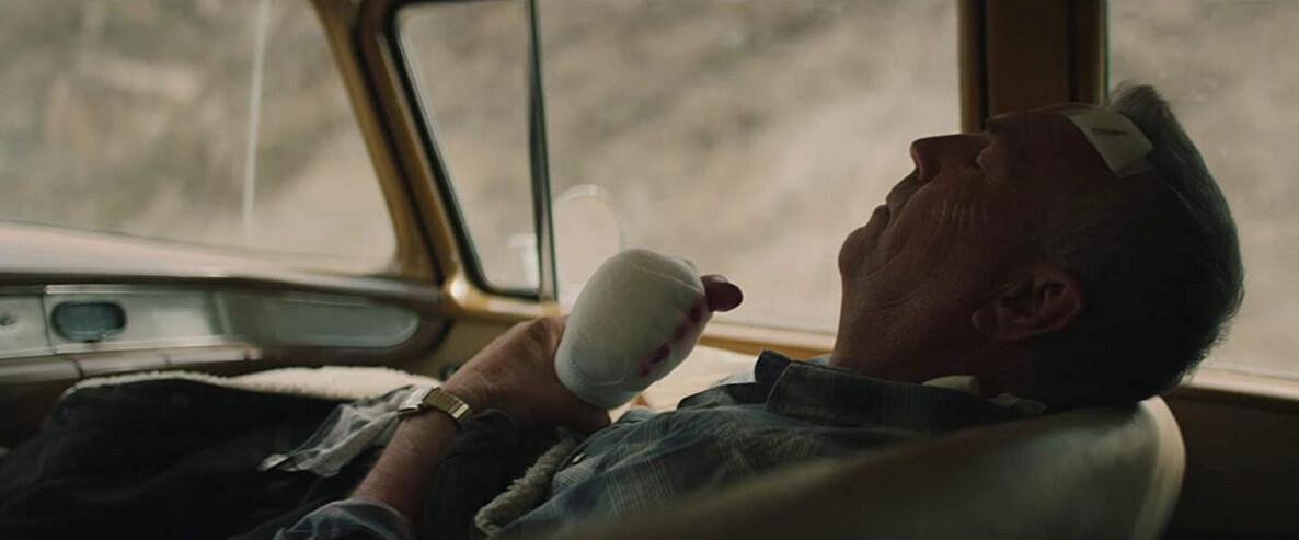 George Blackledge (Kevin Costner) nurses a badly wounded hand in “Let Him Go.” (Focus Features)