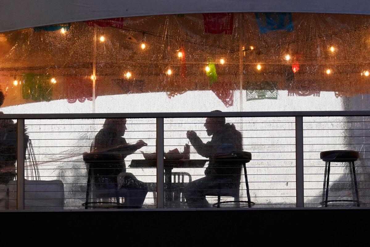 Diners at an outdoor dining area at the Polanco Cantina in Sacramento, Calif., on Jan. 22, 2021. (Rich Pedroncelli/AP Photo)