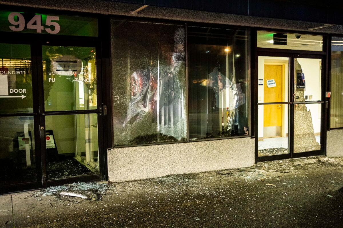 Broken windows are seen at South Sound 911 during a violent demonstration in Tacoma, Wash., on Jan. 24, 2021. (David Ryder/Getty Images)