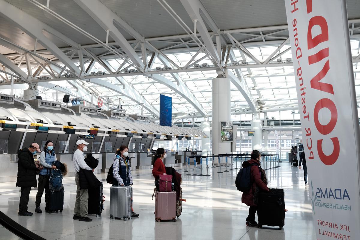 People wait for a flight at an international terminal at John F. Kennedy Airport (JFK) in New York City, on Jan. 25, 2021. (Spencer Platt/Getty Images)