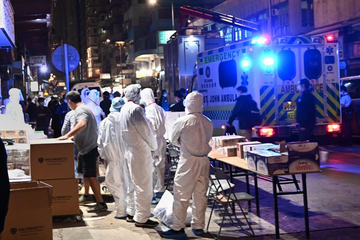 Testing stations were set up on Tung On Street in Yau Ma Tei, Kowloon, Hong Kong, on the evening of Jan. 26, 2021. (Sung Pi Lung/Epoch Times)