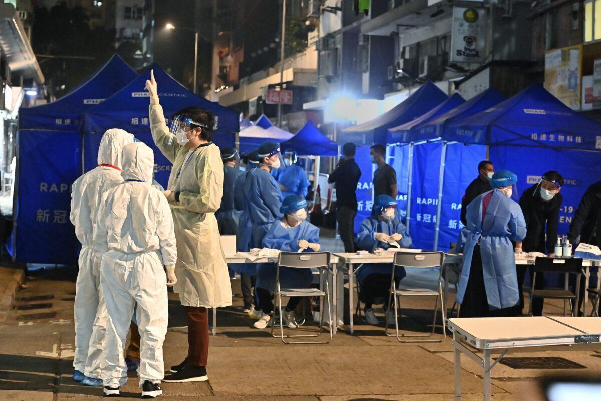 Testing stations were set up on Tung On Street in Yau Ma Tei, Kowloon, Hong Kong, on the evening of January 26, 2021. (Sung Pi Lung/Epoch Times)