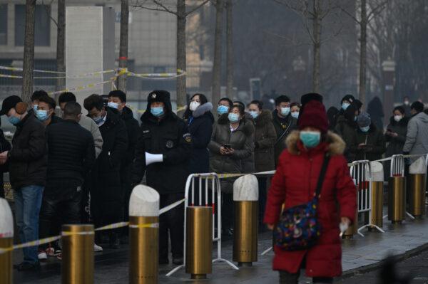 People line up to be tested for the COVID-19 in Daxing district, Beijing, China on Jan. 26, 2021. (STRINGER/AFP via Getty Images)