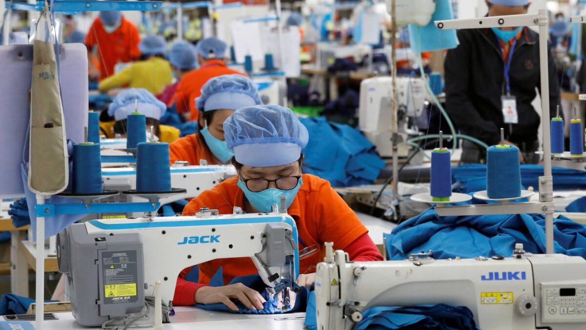 Laborers work at Hung Viet garment export factory in Hung Yen Province, Vietnam, on Dec. 30, 2020. (Kham/Reuters)