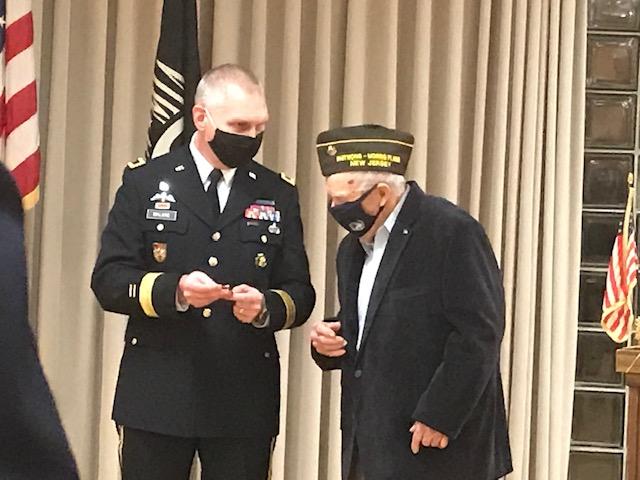 Walter Ness is presented a medal by Brig. Gen. Vincent Malone, commander of Picatinny Arsenal. (Courtesy of <a href="https://www.facebook.com/Morris-Plains-VFW-3401-120838704657285">Morris Plains VFW 3401</a>)