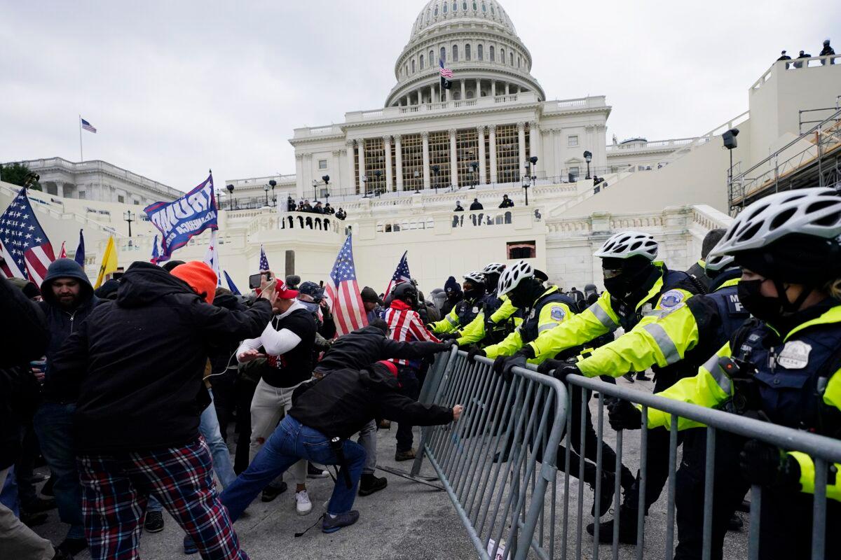 Protesters clash with police at the U.S. Capitol in Washington on Jan. 6, 2021. (Julio Cortez/AP Photo)