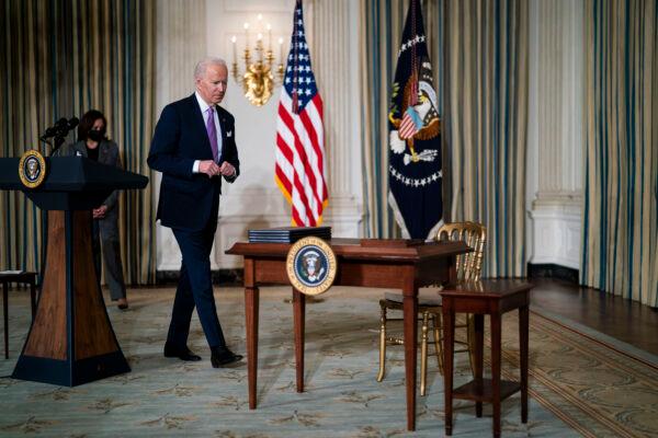 President Joe Biden prepares to sign executive orders related to his racial equity agenda in the White House in Washington on Jan. 26, 2021. (Doug Mills-Pool/Getty Images)