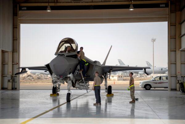 An F-35 fighter jet pilot and crew prepare for a mission at Al-Dhafra Air Base in the United Arab Emirates, on Aug. 5, 2019. (Staff Sgt. Chris Thornbury/U.S. Air Force via AP)