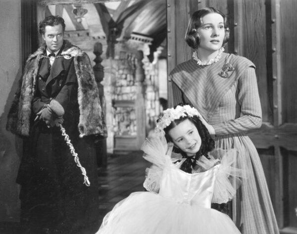 A still shot from the 1943 film “Jane Eyre,” with (L–R) Orson Welles, Margaret O'Brien, and Joan Fontaine. (Public Domain)