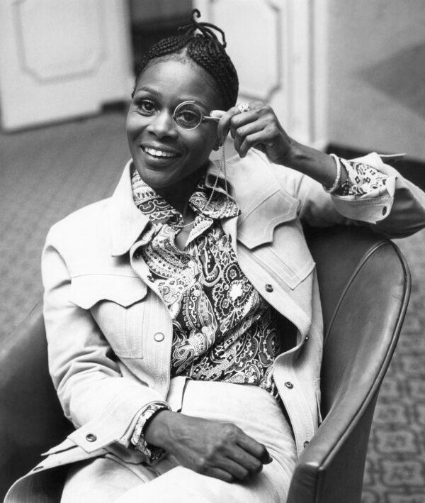 Cicely Tyson peers through a monocle at the Dorchester Hotel in London on Feb. 19, 1973. (AP Photo)