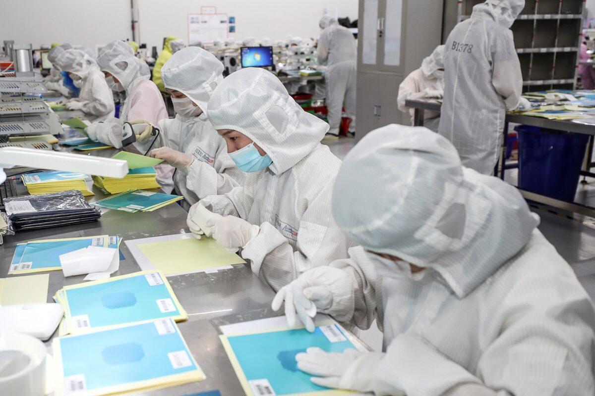 Workers producing LED chips at a factory in Huaian city, in China's eastern Jiangsu Province, on June 16, 2020. (STR/AFP via Getty Images)