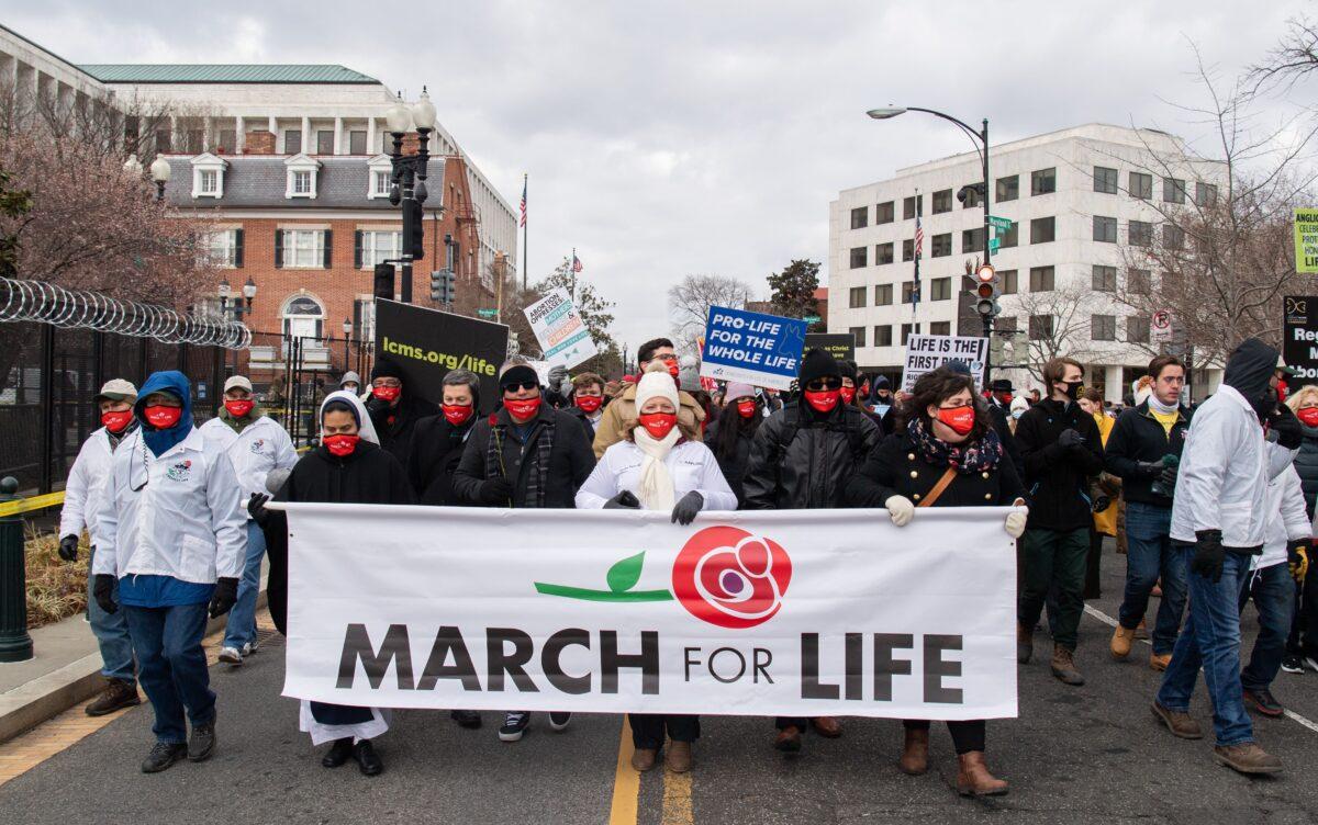 Pro-life activists participate in the "March for Life" outside the U.S. Supreme Court in Washington on Jan. 29, 2021. The annual event marks the anniversary of the 1973 Supreme Court decision in Roe v. Wade, which legalized abortion in the United States. (Saul Loeb/AFP via Getty Images)
