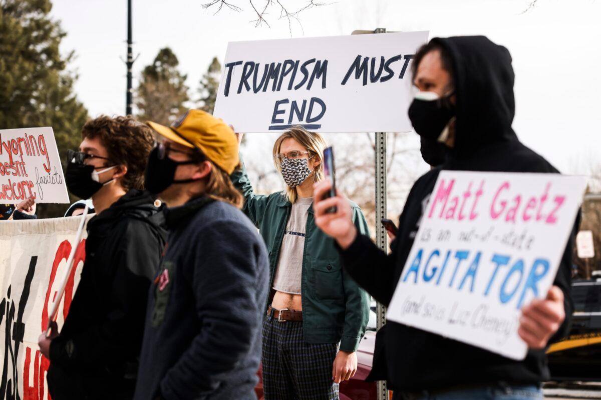 Counter-demonstrators stand to the side as Rep. Matt Gaetz (R-Fla.) speaks during a rally against Rep. Liz Cheney (R-Wyo.) in Cheyenne, Wyo., on Jan. 28, 2021. (Michael Ciaglo/Getty Images)