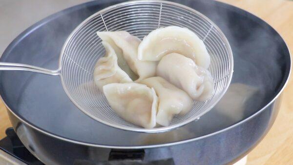 Boil the dumplings. (CiCi Li)