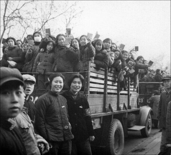 Young Red Guards brandish copies of Chairman Mao's “Little Red Book” in Beijing during the Cultural Revolution in 1966. The Red Guards rampaged through Chinese towns, terrorizing people, particularly the elderly. (Jean Vincent/AFP via Getty Images)