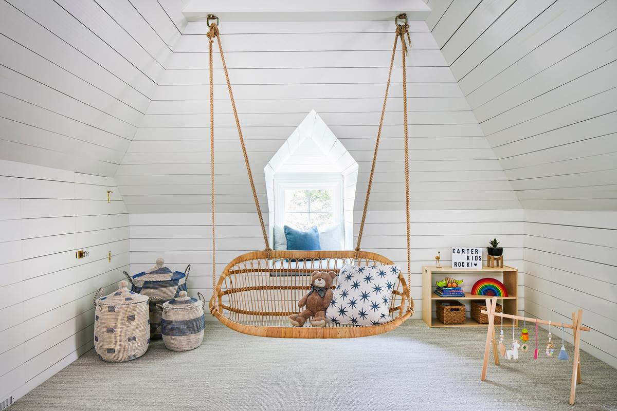 The attic was transformed into a secret play space for the children, including a hanging swing chair for them and their teddy bear. (Laurey Glenn)