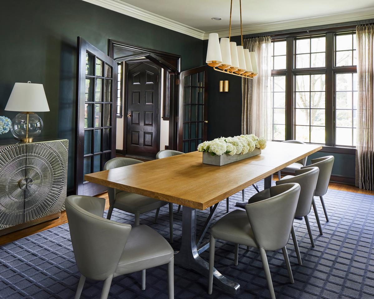 The dark-toned dining room is a more formal space, perfect for elegant entertaining. (Laurey Glenn)
