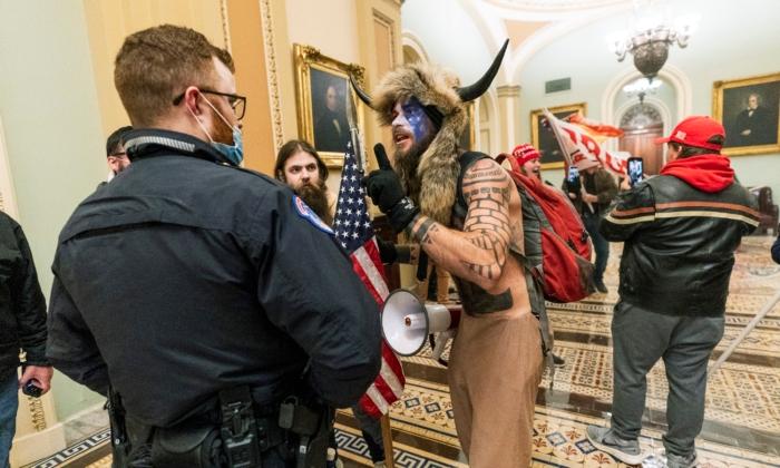 Jacob Chansley (C) and other protesters are seen inside the U.S. Capitol in Washington on Jan. 6, 2021. (Manuel Blace Ceneta/AP Photo)