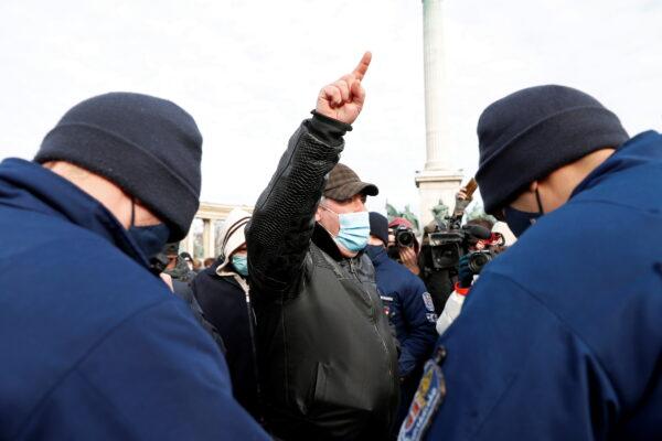A man gestures during a demonstration against the coronavirus disease (COVID-19) measures and their economic consequences at Heroes' Square in Budapest, Hungary, on Jan. 31, 2021. (Bernadett Szabo/Reuters)
