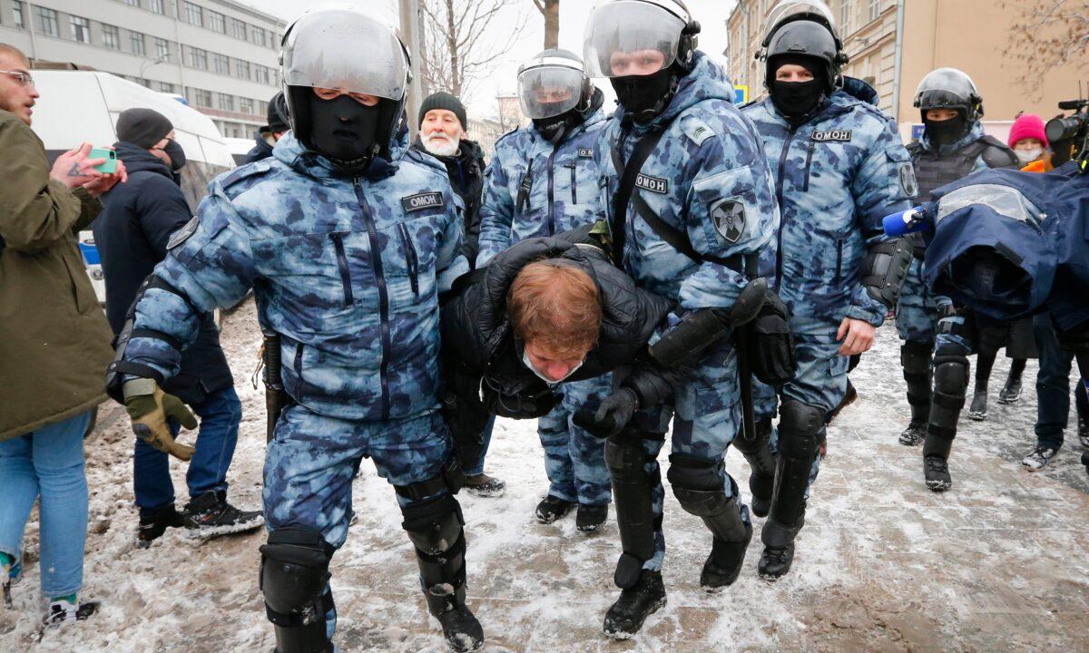 Police officers detain a man during a protest against the jailing of opposition leader Alexei Navalny in Moscow, on Jan. 31, 2021. (Alexander Zemlianichenko/AP Photo)
