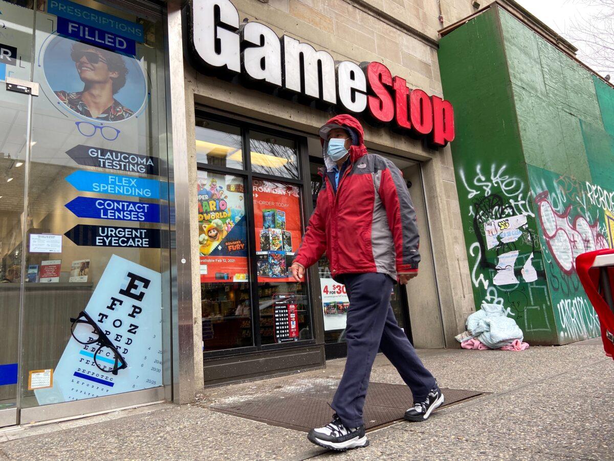 A man walks in front of a GameStop store in the Jackson Heights neighborhood of New York City, on Jan. 27, 2021. (Nick Zieminski/Reuters)