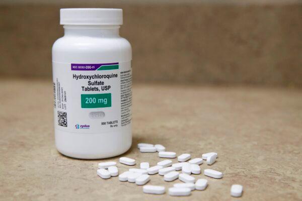 A bottle and pills of hydroxychloroquine sulfate, a <span class="ILfuVd" lang="en"><span class="hgKElc">disease-modifying anti-rheumatic drug,</span></span> sit on a counter at Rock Canyon Pharmacy in Provo, Utah, on May 20, 2020. (George Frey/AFP via Getty Images)