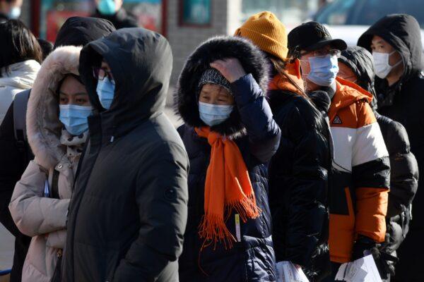 People line up to be tested for the COVID-19 outside a hospital in Beijing, China on Jan. 28, 2021. (Greg Baker/AFP via Getty Images)