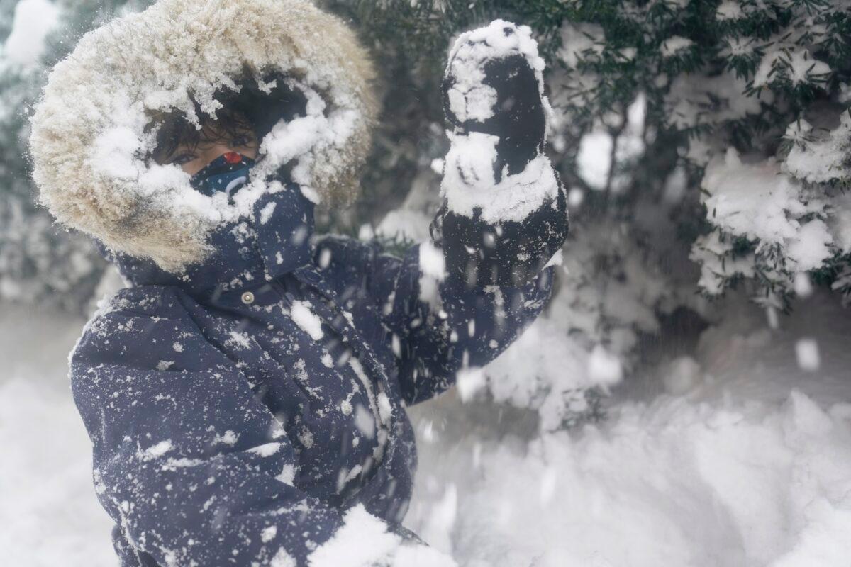Arturo Diaz, 4, enjoys playing in a deep snow bank in Hoboken, N.J., Feb. 1, 2021. (Seth Wenig/AP Photo)