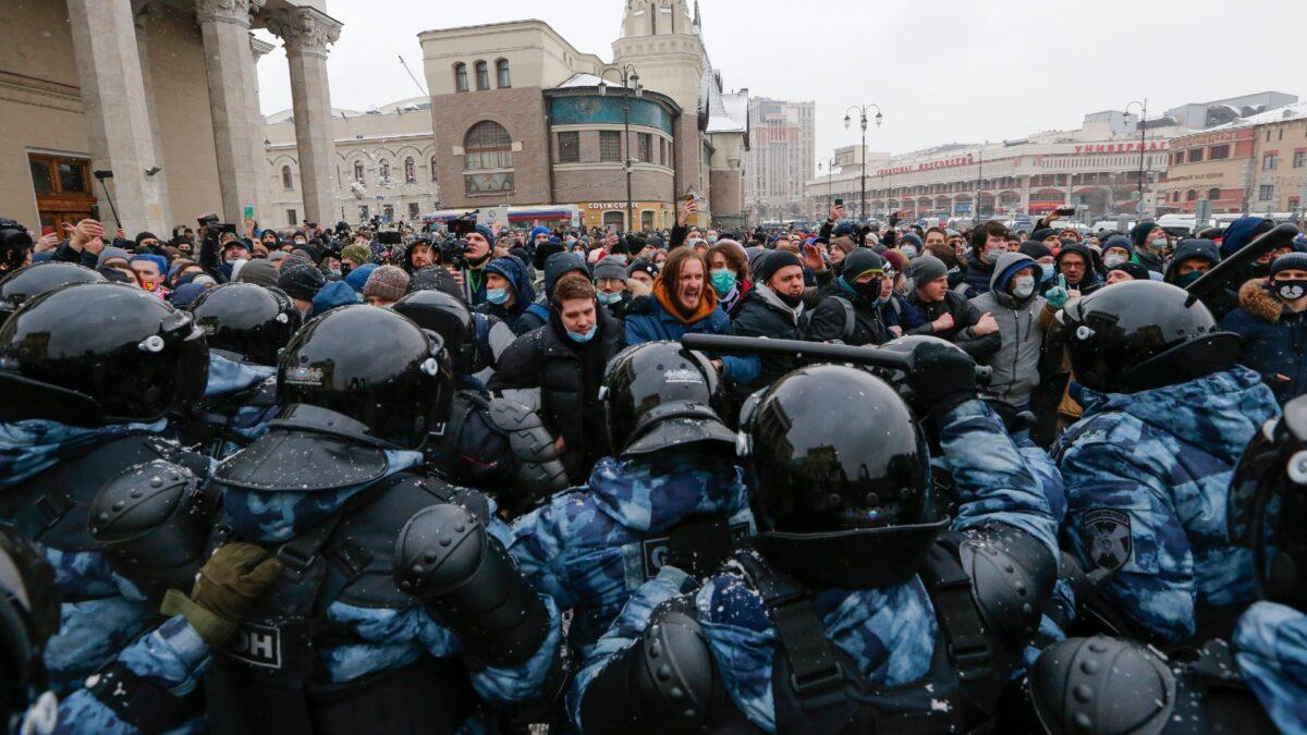 People clash with police during a protest against the jailing of opposition leader Alexei Navalny in Moscow, Russia, on Jan. 31, 2021. (Alexander Zemlianichenko/AP Photo)