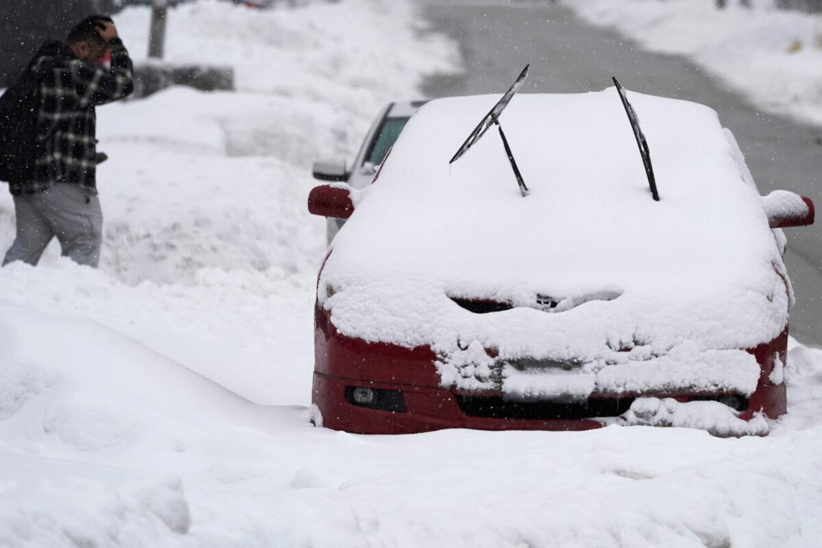 Cars are covered by snow during a winter storm, in Glenview, Ill., on Jan. 31, 2021. (Nam Y. Huh/AP Photo)