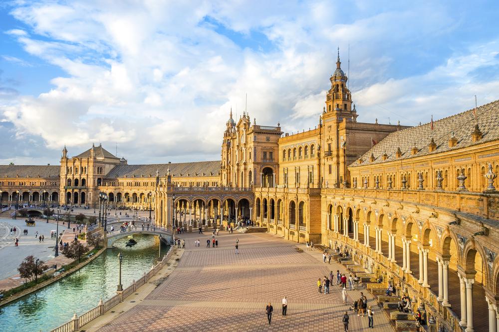 Boat rides can take passengers down the nearly 570-yard canal that flows along the Plaza de España. (S-Studio/Shutterstock.com)
