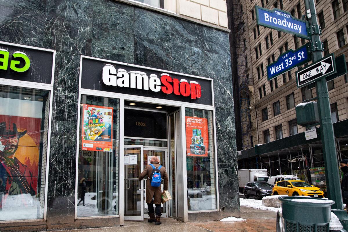 People enter a GameStop store in New York on Feb. 2, 2021. (Chung I Ho/The Epoch Times)