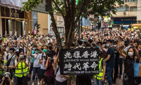 Protesters chant slogans during a rally against Beijing's new national security law in Hong Kong on July 1, 2020. (Dale de la Rey/AFP via Getty Images)