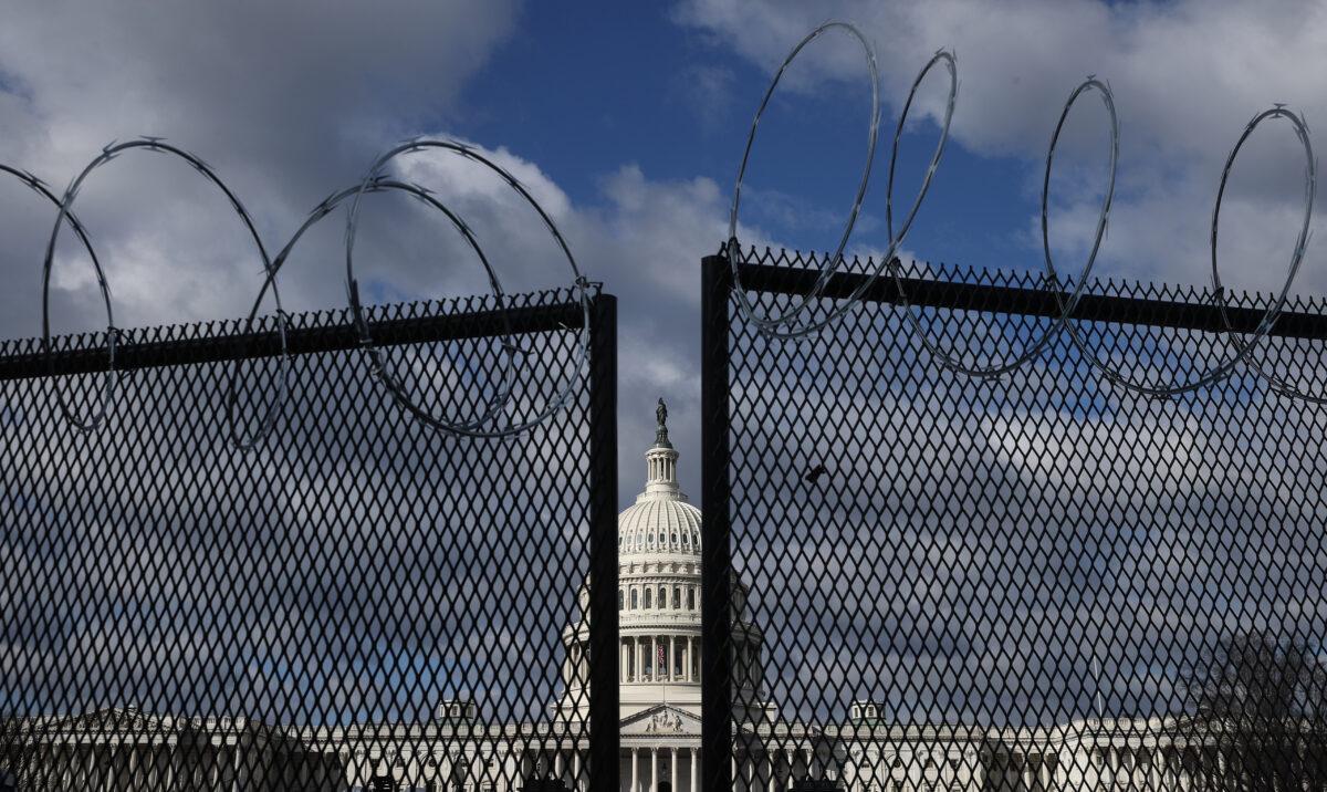 An eight-foot-tall steel fence topped with concertina razor wire circles the U.S. Capitol in Washington on Jan. 29, 2021. (Chip Somodevilla/Getty Images)