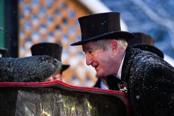 Groundhog Club President Jeff Lundy interacts with Punxsutawney Phil, the weather prognosticating groundhog, during the 135th celebration of Groundhog Day in Punxsutawney, Pa., on Feb. 2, 2021. (Barry Reeger/AP Photo)